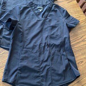 2 black Scrubology tops